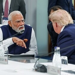 Prime Minister Narendra Modi interacts with US President Donald Trump at the G7 Summit, in Evian 