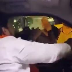 In the video, the man is heard verbally abusing the students before proceeding to grab the collar of one of them and hitting him.