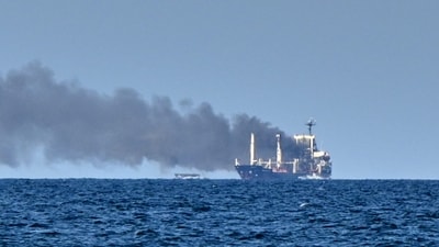 Smoke rises from the grain carrier Golden Leo under the Guinea-Bissau flag after Russian missile strike in the Black Sea close to Odessa, Ukraine, Sunday, July 19, 2026, local media reports. 