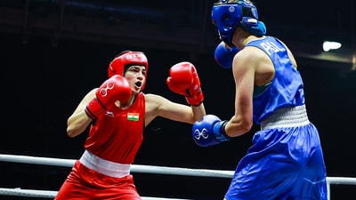 File picture of Indian boxer Parveen Hooda (red), who will compete in 65kg at the Glasgow Commonwealth Games. (BFI Photo) File picture of Indian boxer Parveen Hooda (red), who will compete in 65kg at the Glasgow Commonwealth Games. (BFI Photo)