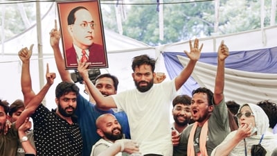 Cockroach Janta Party (CJP) founder Abhijit Debaki celebrates after Union Education Minister Dharmendra Pradhan resigned and took responsibility for NEET paper leak, at Jantar Mantar in New Delhi. (PTI)