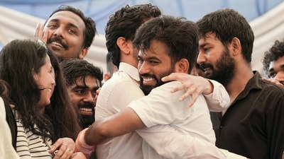 Cockroach Janta Party (CJP) Founder Abhijeet Dipke, with supporters, celebrates after Union Education Minister Dharmendra Pradhan resigned and took responsibility for the NEET paper leak, at Jantar Mantar in New Delhi. (PTI)