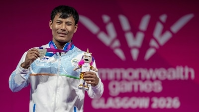 Silver medallist India's Rishikanta Singh poses for photographs during the presentation ceremony after the men's 60kg weightlifting competition (PTI) Silver medallist India's Rishikanta Singh poses for photographs during the presentation ceremony after the men's 60kg weightlifting competition (PTI)
