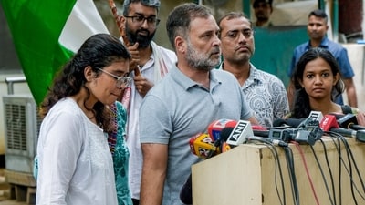 LoP in Lok Sabha and Congress MP Rahul Gandhi with an injured victim during the police crackdown on students in the 'Sansad chalo' march, addresses a press conference amid the ongoing protest over the NEET paper leak issue, in New Delhi, Saturday, July 25, 2026. (PTI)