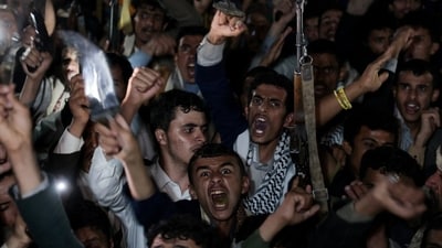 Houthi supporters protesting an attack on the San’a airport in Yemen.