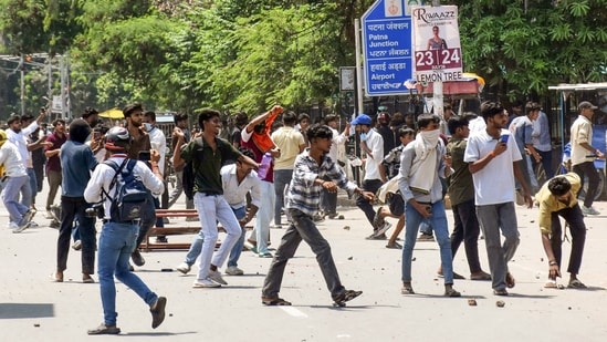Protesters pelt stones during the 'Bihar Bandh' protest against the alleged NEET paper leak, in Patna on Saturday. (Pappi Sharma/ANI)