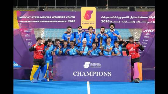 India team members celebrate with the trophy in Doha. (Hockey India)