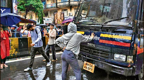 Mumbai: Rhiya Ahir, a 27-year-old model, stands with her arms outstretched in front of a police van during a demonstration in solidarity with the CJP's agitation over the alleged NEET irregularities, in Mumbai, Wednesday, July 22, 2026. (PTI)