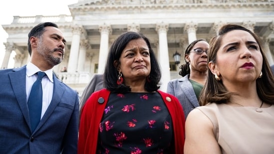 Rep. Pramila Jayapal (D., Wash.), in red, with members of the Congressional Progressive Caucus at the U.S. Capitol.