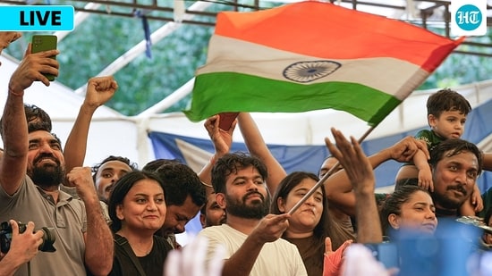 Cockroach Janta Party (CJP) Founder Abhijeet Dipke, with supporters, celebrates after Union Education Minister Dharmendra Pradhan resigned and took responsibility for the NEET paper leak, at Jantar Mantar in New Delhi, Saturday, July 25, 2026.