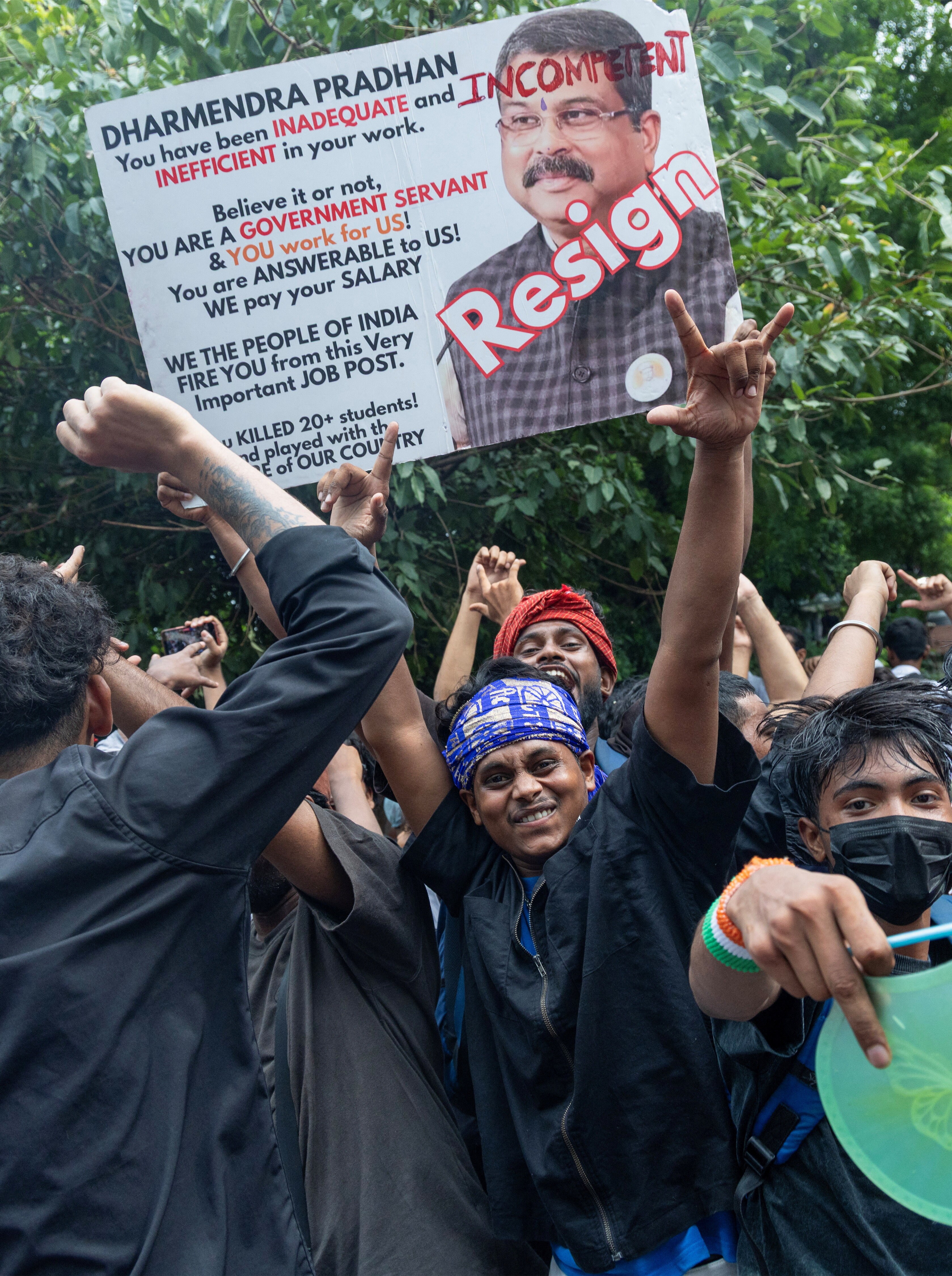 Supporters of India's Cockroach Janta Party (CJP) celebrate after India's Education Minister Dharmendra Pradhan resigned following days of protests in New Delhi, India, July 25, 2026. (REUTERS)