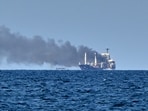 Smoke rises from the grain carrier Golden Leo under the Guinea-Bissau flag after Russian missile strike in the Black Sea close to Odessa, Ukraine,