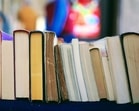 11 novels stand in a row. Can you determine their order?