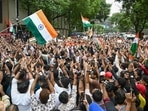 Demonstrators wave the national flag during a CJP protest rally in Mumbai.