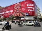 Motorists drive past a large billboard pledging revenge against US President Donald Trump along Jomhouri Street in central Tehran on July 27, 2026. Iran's foreign ministry said on July 27 that the US was not involved in recent talks with Oman over the administration of the strategic Strait of Hormuz. Traffic through the vital global shipping route has largely been under Iranian control since the outbreak of war with Israel and the United States on February 28. 