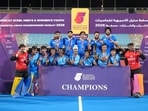 India team members celebrate with the trophy in Doha. (Hockey India)
