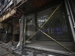 A view of the fire-ravaged hotel in Malviya Nagar, nearly a month after a devastating blaze tore through the multi-storey building, killing 22 people.