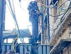 PSPCL employees repair transformer in Ludhiana on Saturday. (Gurpreet Singh/HT)