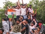 Cockroach Janta Party (CJP) supporters celebrate after Union Education Minister Dharmendra Pradhan resigned.