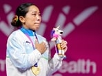 Mirabai Chanu reacts after winning gold medal in the women's 48kg Final weightlifting competition at the 23rd Commonwealth Games.