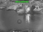 Smoke rises after a U.S. one-way attack surface drone reached its target, a submarine and ship maintenance facility according to U.S. Central Command, in Bandar Abbas, Iran, in this screengrab taken from a video, which was released July 13, 2026.
