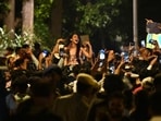 Students celebrate after the education minister's resignation at Jantar Mantar in Delhi on Saturday