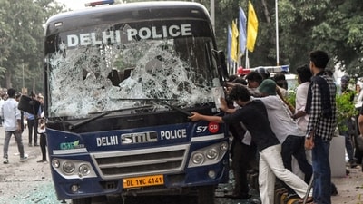Protesters seen by a police van during a protest march to Parliament on July 20. (ANI)
