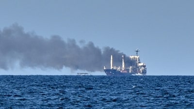 Smoke rises from the grain carrier Golden Leo under the Guinea-Bissau flag after Russian missile strike in the Black Sea close to Odessa, Ukraine, (AP) Smoke rises from the grain carrier Golden Leo under the Guinea-Bissau flag after Russian missile strike in the Black Sea close to Odessa, Ukraine, (AP)