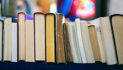 11 novels stand in a row. Can you determine their order?