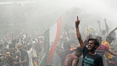 Police personnel use a water cannon on All India Students' Association (AISA) activists during a protest march near Lok Bhavan in Bihar demanding the resignation of Union Education Minister Dharmendra Pradhan (PTI)