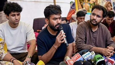 Cockroach Janta Party (CJP) founder Abhijeet Dipke addresses a press conference as party spokepersons Saurav Das and Ashutosh Ranka look on, amid the protest over NEET paper leak issue, at Jantar Mantar (PTI) Cockroach Janta Party (CJP) founder Abhijeet Dipke addresses a press conference as party spokepersons Saurav Das and Ashutosh Ranka look on, amid the protest over NEET paper leak issue, at Jantar Mantar (PTI)