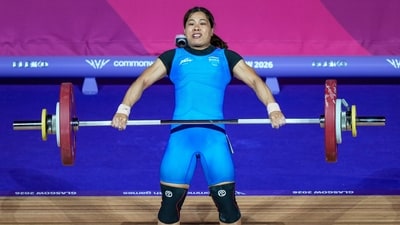 India's Bindyarani Devi competes in the Women's 58kg weightlifting event. 
