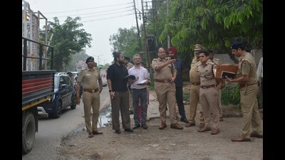 Railway and police officials inspect the road outside the Chandigarh railway station on Monday. (Sant Arora/HT)