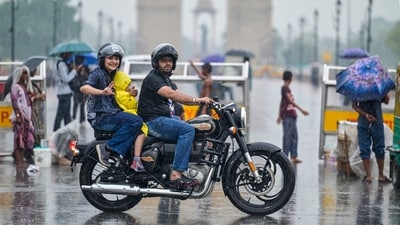 Gram it: What's the fun if you don't go for a ride when it rains in Delhi! Here's how some visitors were spotted doing just that while enjoying the monsoon at India Gate, Kartavya Path, on Monday. As per India Meteorological Department, localised showers are expected in the city today as well. (Photo: RAJ K RAJ / Hindustan Times)