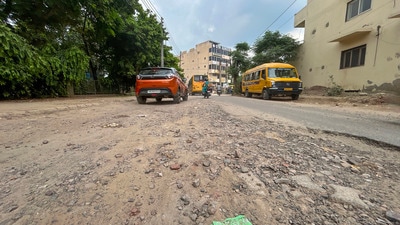 Residents of Sector 46 said potholes, exposed bitumen, construction debris and waterlogging have made several roads unsafe, especially during night-time travel. (Parveen Kumar/HT)