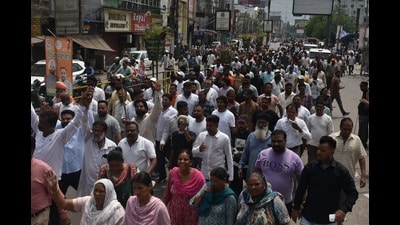 Sanitation workers taking out a protest march in Jalandhar on Monday. (HT)