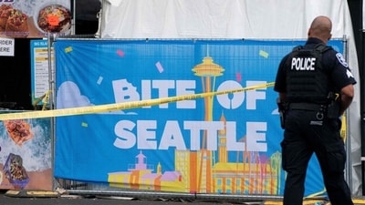 SEATTLE, WA - JULY 26: A police officer walks past a 