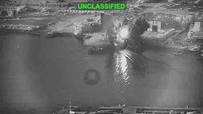 Smoke rises after a U.S. one-way attack surface drone reached its target, a submarine and ship maintenance facility according to U.S. Central Command, in Bandar Abbas, Iran, in this screengrab taken from a video, which was released July 13, 2026. (US Central Command/Handout via REUTERS )