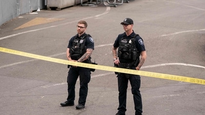 Police officers keep watch after a mass shooting at the Bite of Seattle food festival on July 26, 2026 in Seattle, Washington. (Getty Images via AFP)