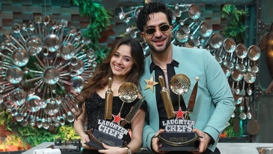 Aly Goni and Jannat Zubair lift the trophy of Laughter Chefs season 3.