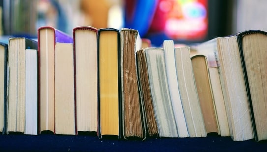 11 novels stand in a row. Can you determine their order?