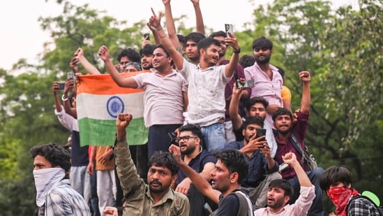 Cockroach Janta Party (CJP) supporters celebrate after Union Education Minister Dharmendra Pradhan resigned.