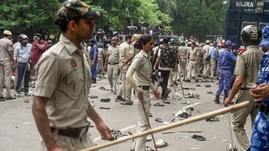 Police personnel carry out a lathi charge on protesters during the protest march against the alleged NEET paper leak from Jantar Mantar to Parliament House in New Delhi.