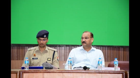 SSP Avinash Pandey and DM VK Singh addressing newspersons in Meerut on Monday (HT Photo)