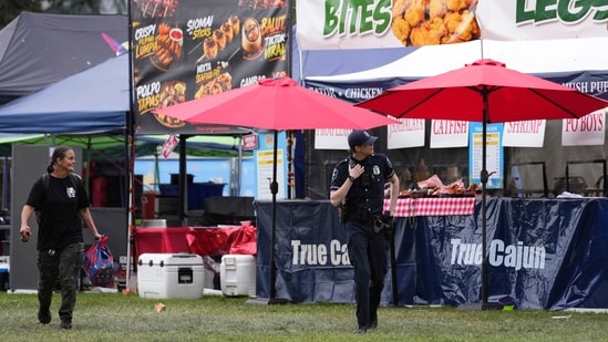 Police respond to a shooting at Seattle Center during the Bite of Seattle food festival Sunday, July 26, 2026, in Seattle, Wash. (AP Photo/Lindsey Wasson) (AP Photo/Lindsey Wasson)