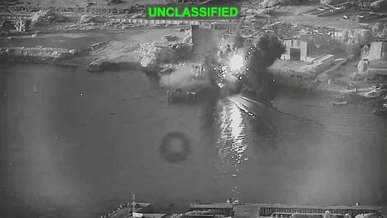 Smoke rises after a U.S. one-way attack surface drone reached its target, a submarine and ship maintenance facility according to U.S. Central Command, in Bandar Abbas, Iran, in this screengrab taken from a video, which was released July 13, 2026.