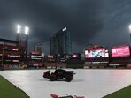 The field at Busch Stadium is covered in anticipation of thunderstorms before a game between the St. Louis Cardinals and the Chicago Cubs. Dilip Vishwanat/Getty Images/AFP 