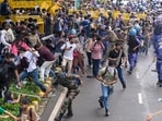 Security personnel carry out a lathi charge during the CJP protest march near the Parliament in New Delhi, India, on Monday, July 20, 2026.  