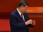 Chinese President Xi Jinping, left, gestures to Chinese Premier Li Qiang during a ceremony to mark the 105th anniversary of the founding of the Chinese Communist Party at the Great Hall of the People in Beijing, Wednesday, July 1, 2026. (AP Photo/Ng Han Guan)