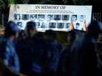 A banner shows photographs of students who allegedly took their lives following the NEET-UG 2026 paper leak, during a protest at Jantar Mantar in New Delhi.